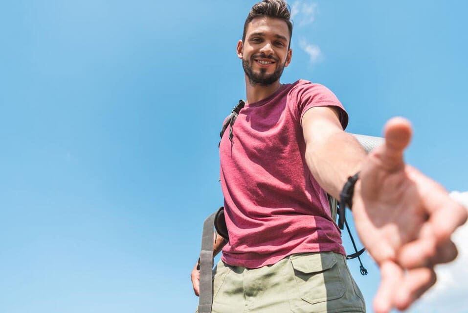 Man reaching hand out