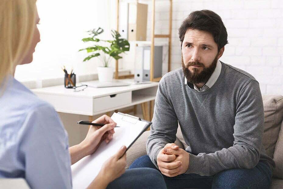 Man talking with counselor