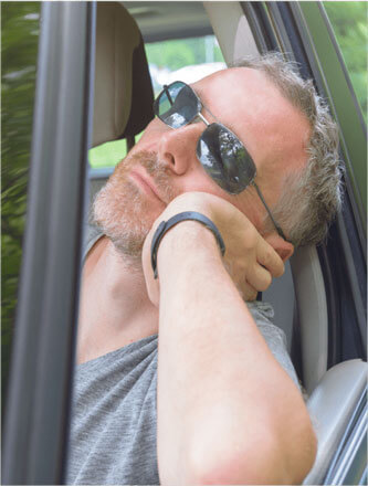 Man asleep in car window