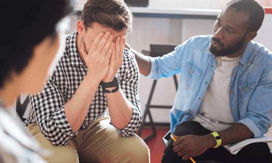 Man comforting one another