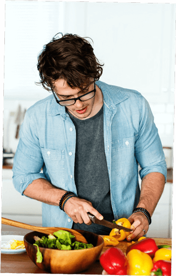 Man cutting yellow peppers