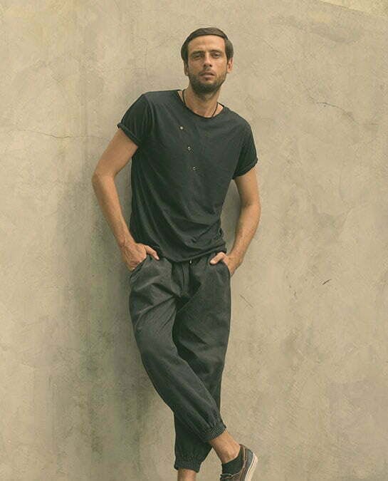 Man leaning against a wall