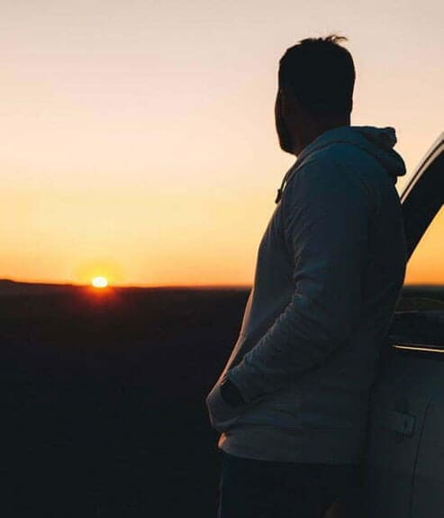 Man looking at sunset