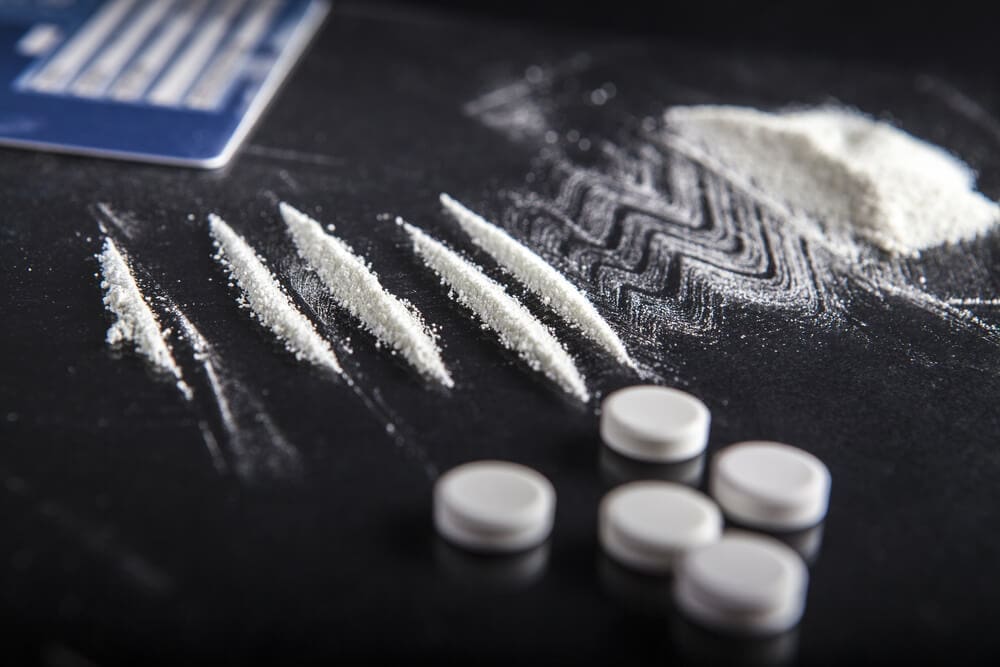 A white powder on a table next to a credit card at an addiction recovery center.