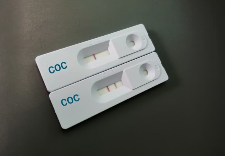 Two test tubes labeled "coc" at an addiction recovery center.