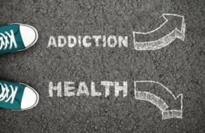 Mens' rehab shoes with the words addiction and health stylishly written on them.