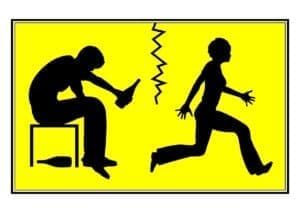 A silhouette of a man and woman running away from each other towards an addiction recovery center.